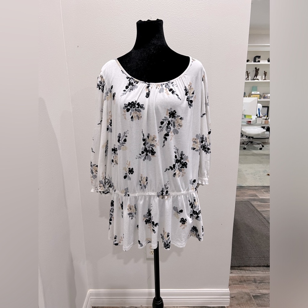 Flattering waist cinching blouse with black, grey, & tan floral print.